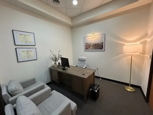 Private consultation area with guest seating