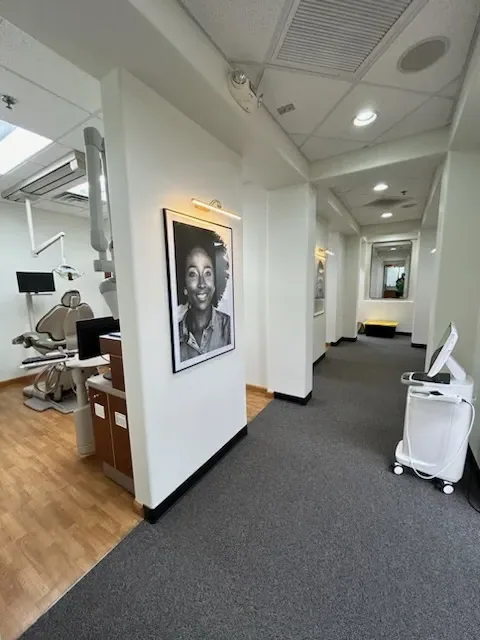 Dental office hallway with framed artwork