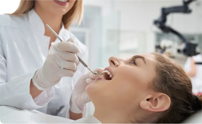 Dentist providing treatment in an operatory