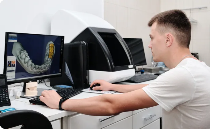 Patient positioned for dental imaging with CBCT equipment