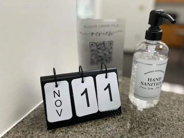 Calendar and hand sanitizer on the office counter