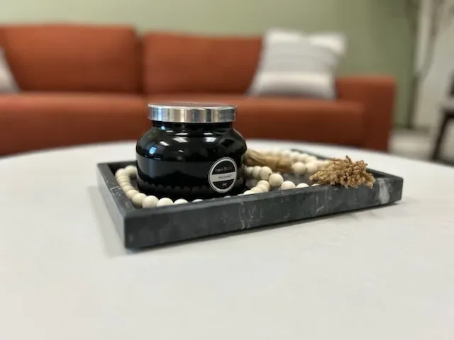 Decorative bowl with a candle on a table in the patient waiting area