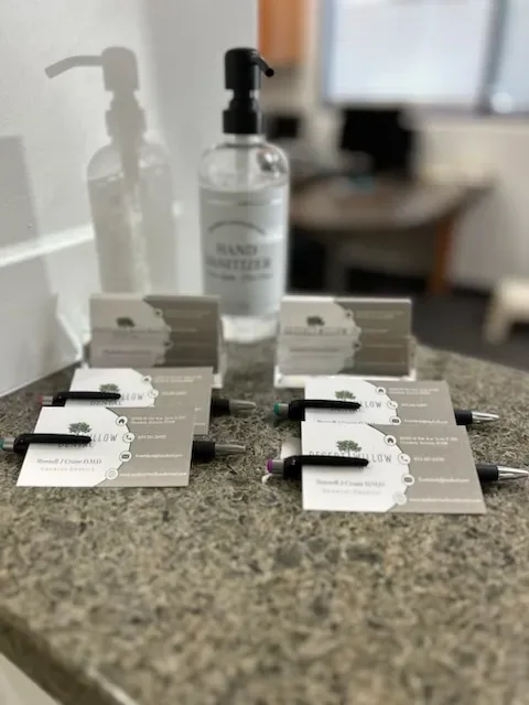 Hand sanitizer with patient information cards displayed at reception