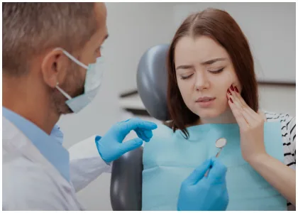 Dentist examining a patient in a dental chair