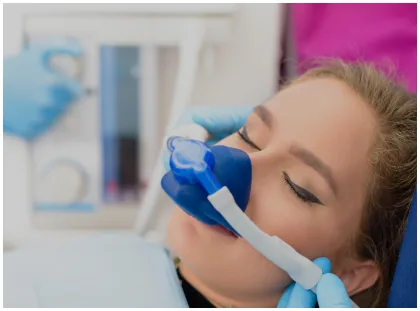 Patient wearing a nitrous oxide mask during dental care