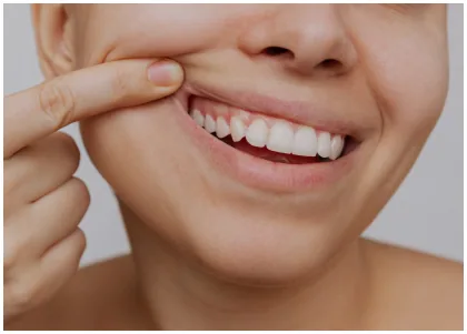 Dental professional examining a patient's gums