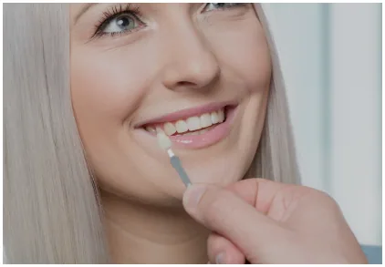 Patient receiving cosmetic dental care focused on the front teeth
