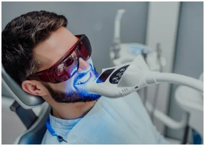Patient receiving a teeth bleaching treatment